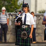 Band member playing pipes